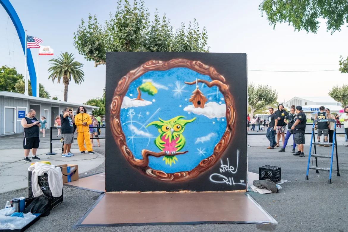 A circular mural of the earth painted in warm tones.