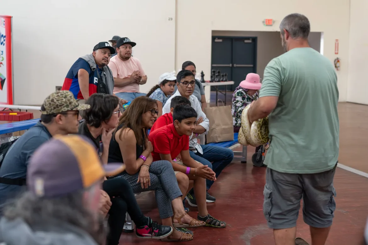 Families fill the bleachers to watch the livestock judging.