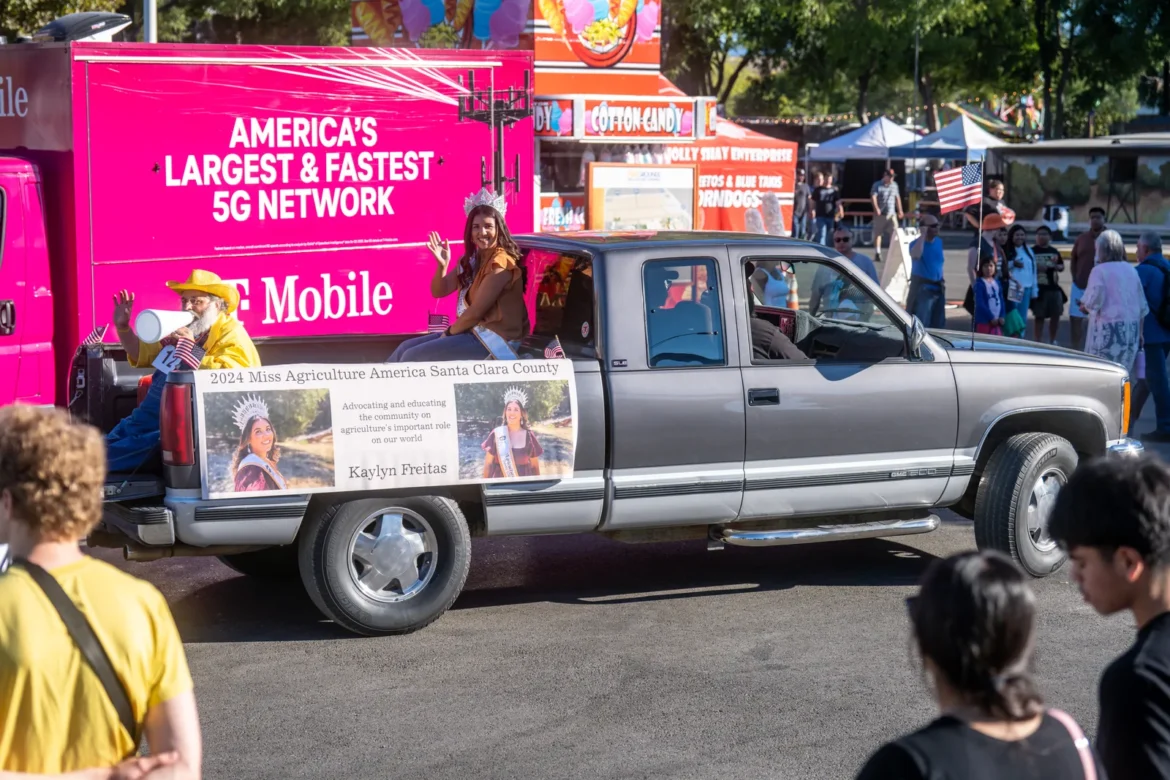A decorated pickup rolls down the parade route.