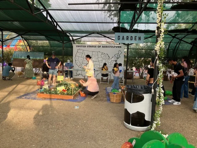 The Garden area, with planting stations under the shade canopy.